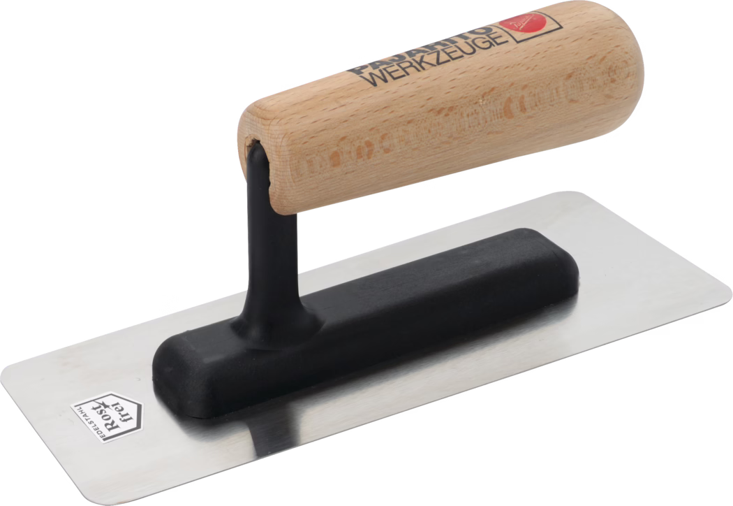 Une truelle de haute qualité avec un manche en bois et une lame en acier inoxydable. Le manche en bois est conçu de manière ergonomique pour une prise en main confortable, tandis que la lame est plate et lisse, idéale pour appliquer et lisser des matériaux comme le plâtre ou le ciment. La base du manche a une prise en caoutchouc noir pour un meilleur confort. La lame présente une finition brillante, indiquant qu'elle est fabriquée en acier inoxydable durable, résistant à la rouille et à la corrosion, ce qui améliore sa longévité pour un usage professionnel ou de bricolage.
